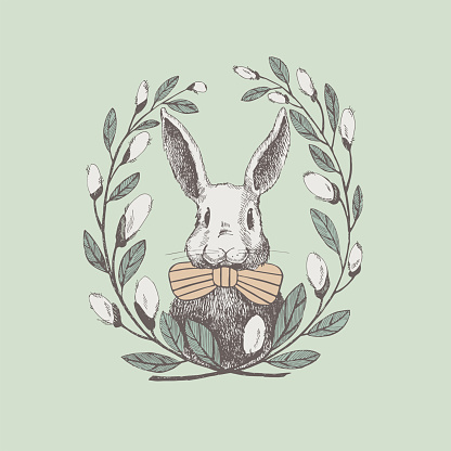 Cute white rabbit in a frame of willow twigs. Vector spring holiday greeting poster design element. Vintage illustration of a funny hare. Cozy design of an Easter card.