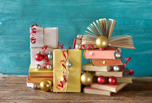 books as christmas gift,christmas present,reading,literature,education,making a gift concept