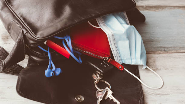 istock Woman hand bag open  with accessories 1285447260