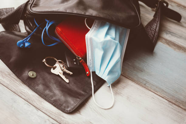 istock Woman hand  bag open  with accessories 1285447265