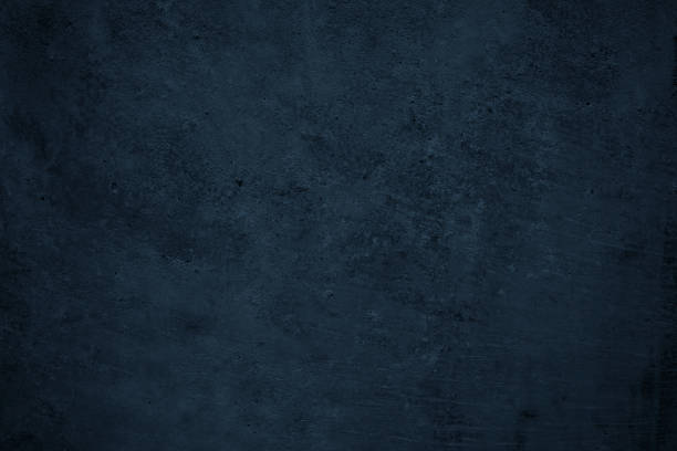 istock Dark grunge background. Black blue abstract rough background. Toned concrete wall texture. 1285447403