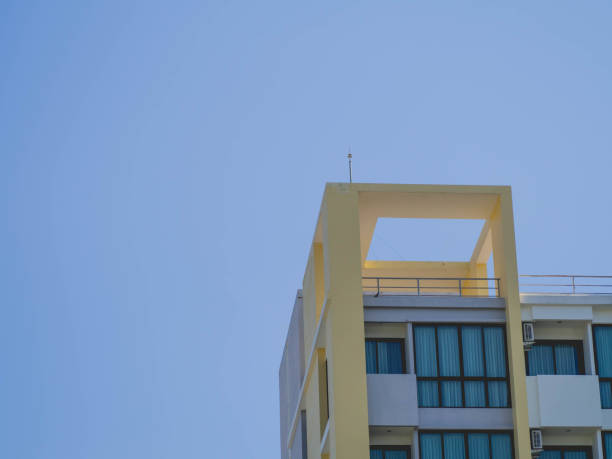 Yellow tall condos and sky