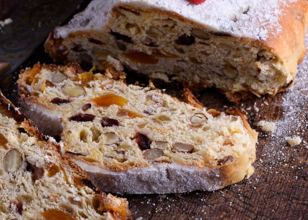 istock Stollen, a traditional European cake with nuts and candied fruit, is dusted with icing sugar 1285454203
