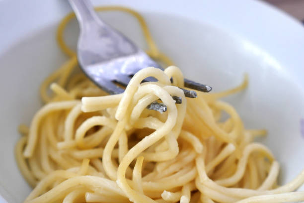 istock close-up, pasta on the tip of the fork, 1285455512
