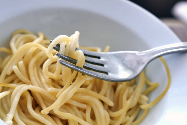 istock close-up, pasta on the tip of the fork, 1285455584