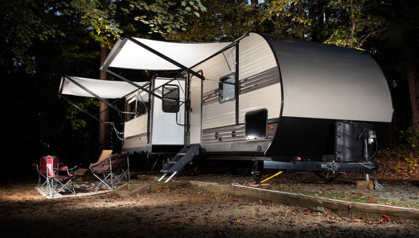 istock Camper trailer late in the day in a forest 1285456635