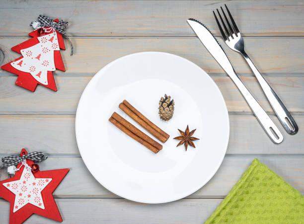 istock Empty plate with Christmas and New Year decoration for the holiday menu 1285457054