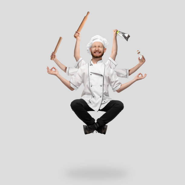 istock Cooker, chef, baker in uniform multitask like shiva isolated on gray studio background 1285461547