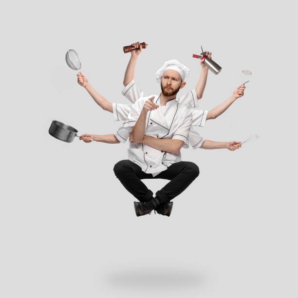 istock Cooker, chef, baker in uniform multitask like shiva isolated on gray studio background 1285461549