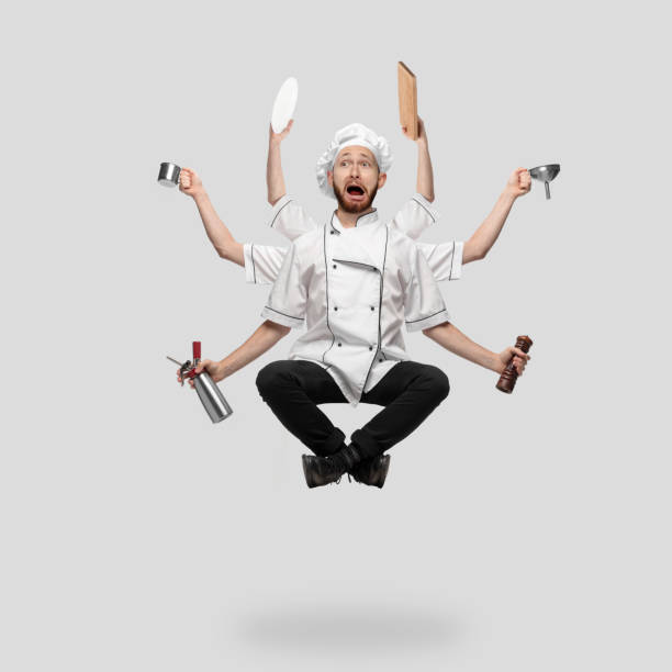 istock Cooker, chef, baker in uniform multitask like shiva isolated on gray studio background 1285461550