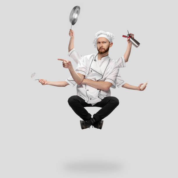 istock Cooker, chef, baker in uniform multitask like shiva isolated on gray studio background 1285461553