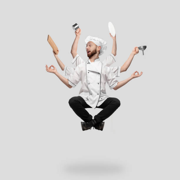 istock Cooker, chef, baker in uniform multitask like shiva isolated on gray studio background 1285461557
