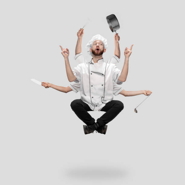 istock Cooker, chef, baker in uniform multitask like shiva isolated on gray studio background 1285461562