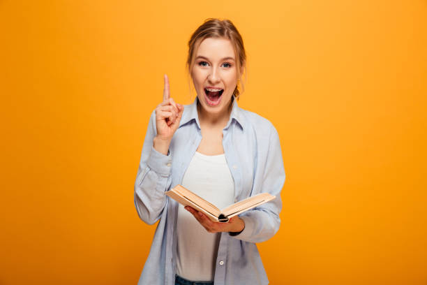 istock Excited young lady student reading book have an idea. 1285464479