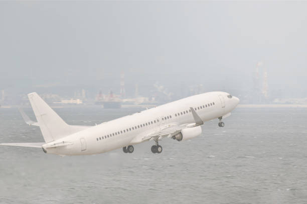 istock white airplane taking off in haze afternoon with ocean background 1285466577