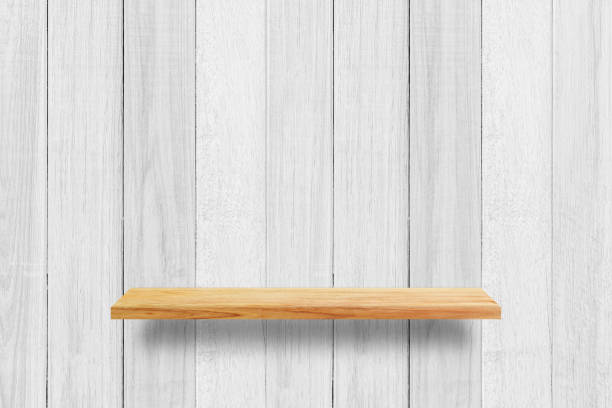 istock Empty wood shelf on white wooden wall texture background. 1285466855