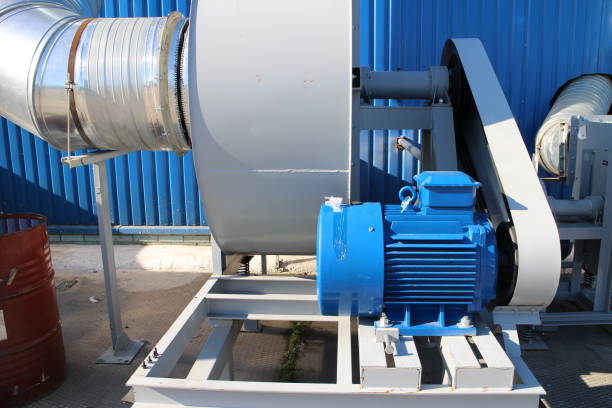 istock Blue hangar wall and large fans 1285468466