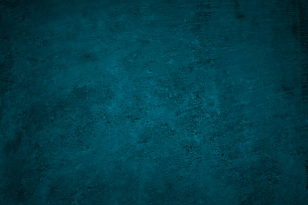 istock Blue green grunge background. Dark abstract rough background. Toned concrete wall texture. Combination of teal color and grunge texture. 1285471990