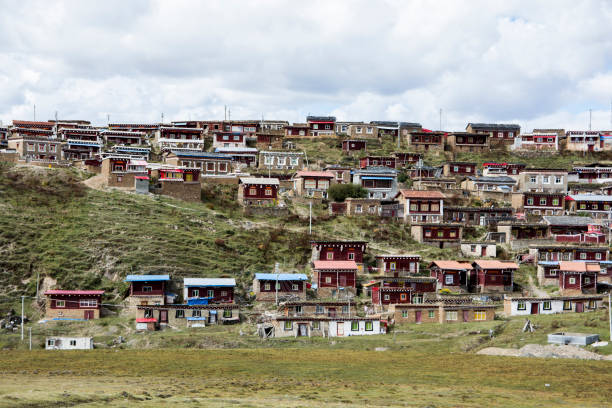 Colorful village on the hill,  in the grasslands of Tagong, Sichuan, China. stock photo
