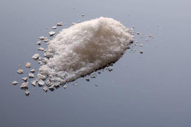 istock flakes of  crisp maldon crystals salt on light blue background 1285473850