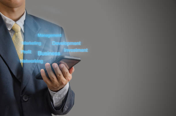 istock Business man holding a mobile phone text digital 1285474762