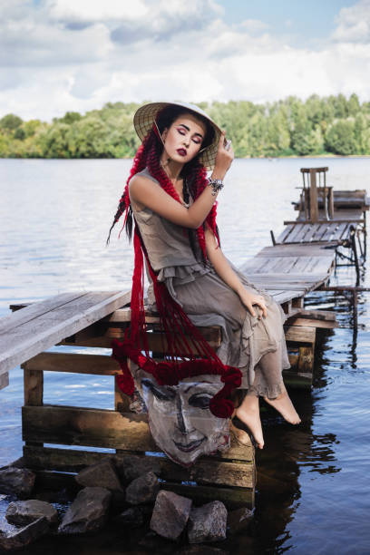 istock Asian woman by the river 1285475540
