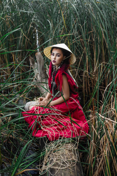 istock Asian woman in reed 1285475899