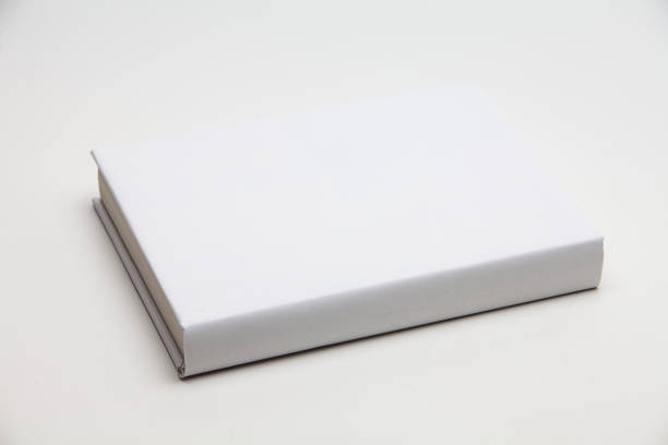 istock Blank book cover white on white background 1285476377