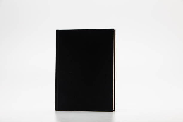 istock Stand Black blank book isolated on white background 1285476716