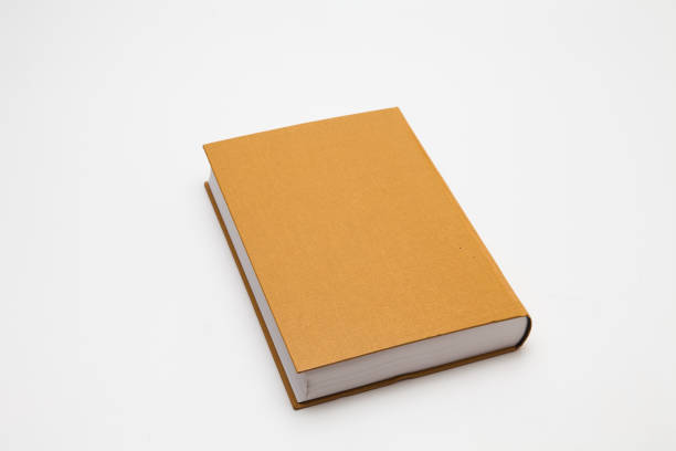 istock Gold color blank book on white background 1285476736