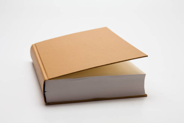 istock Gold color blank book on white background 1285476758
