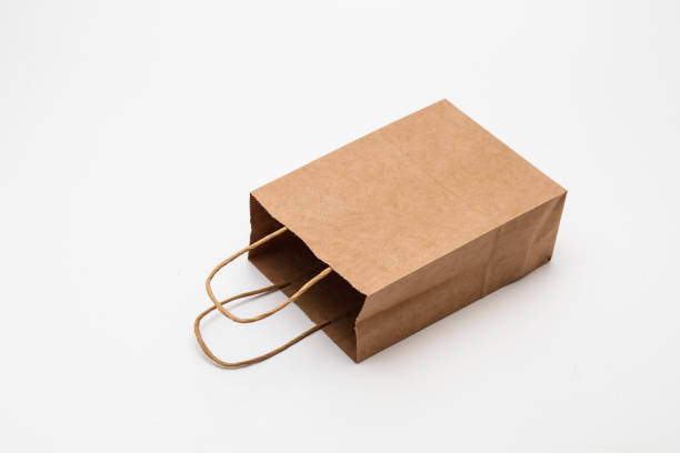 istock Empty open brown paper bags for shopping and other cary use 1285477936