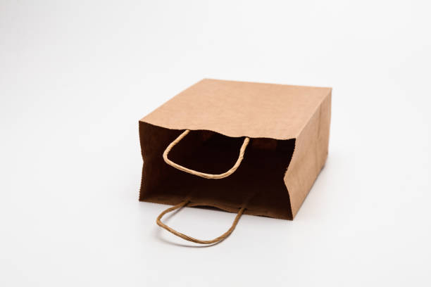 istock Empty open brown paper bags for shopping and other cary use 1285477953