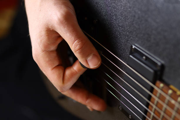 istock male guitarist playing electric guitar 1285478285