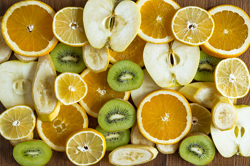 Kiwi, banana, orange, lemon and apple cut into circles