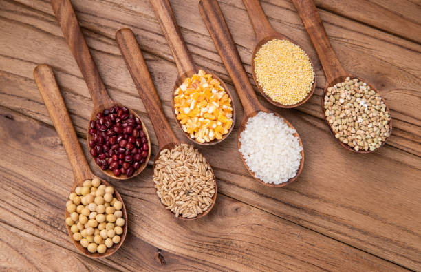 istock Wooden spoon is filled with grain 1285481095