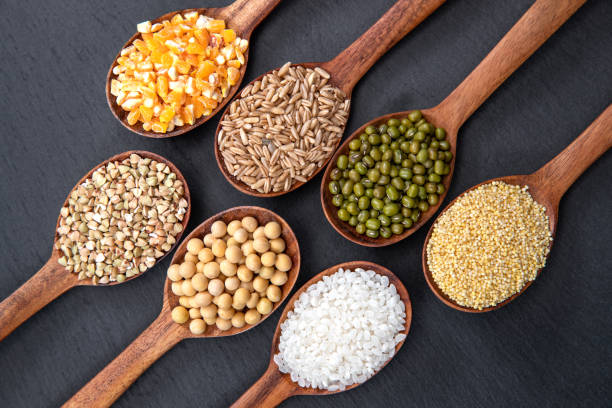istock Wooden spoon is filled with grain 1285481175