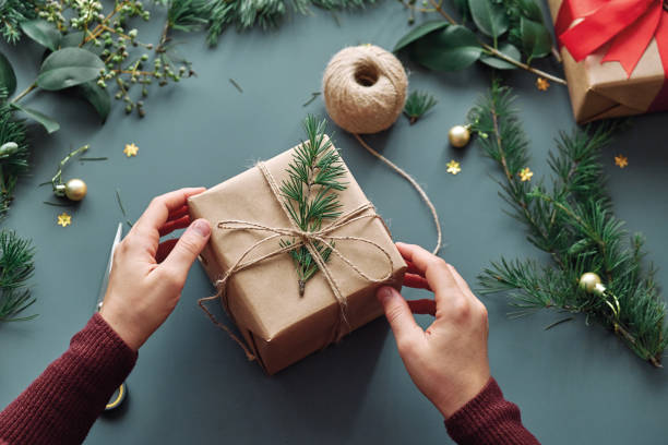 istock Woman preparing christmas gift 1285483115