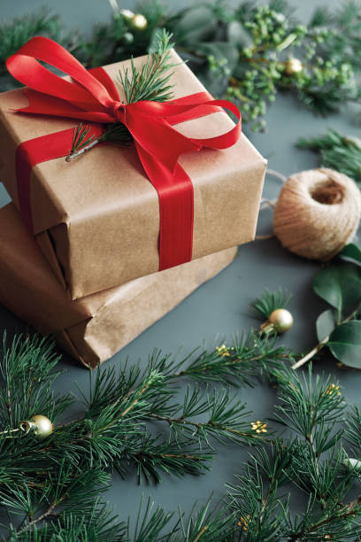 istock Christmas background, gift box and pine tree branchs 1285483283