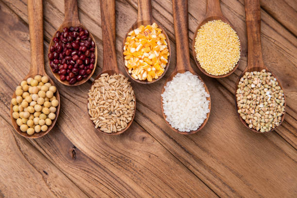 istock Wooden spoon is filled with grain 1285483932