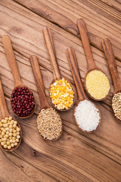 istock Wooden spoon is filled with grain 1285483987
