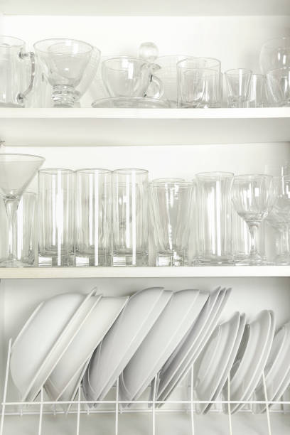 open and full cupboard open cupboard with variety of glasses and dishes plate rack stock pictures, royalty-free photos & images