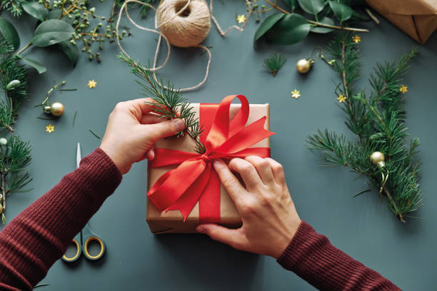 istock Woman preparing christmas gift 1285484432