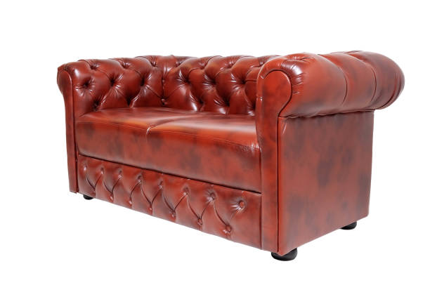 istock brown luxurious leather office sofa isolated on white background, side view 1285484661