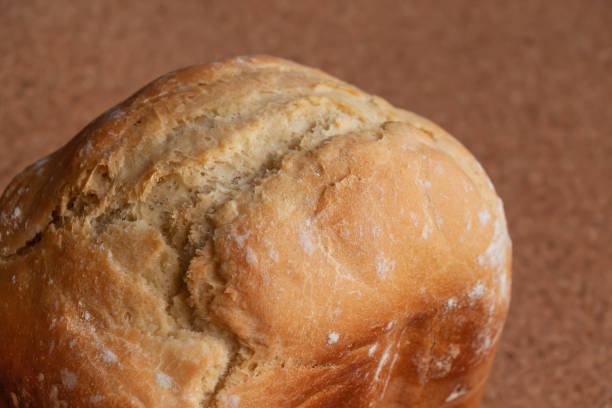istock Whole loaf of white bread close up 1285484908