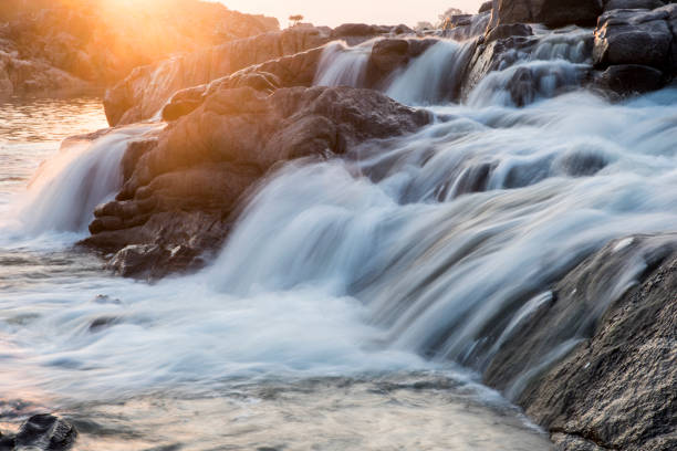 istock waterfall in the mountains at evening 1285486120
