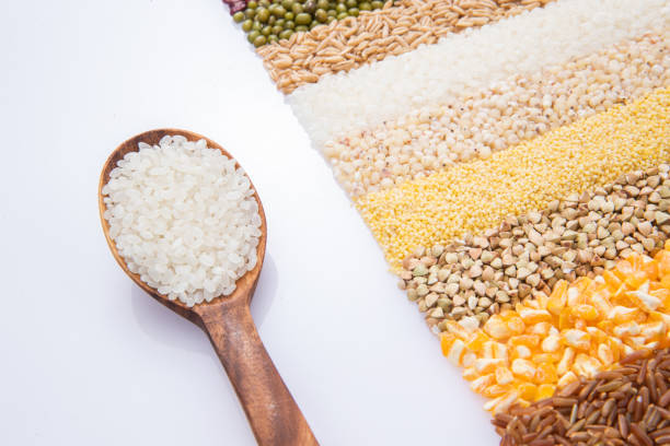 Grain tile and the wooden spoon with rice
