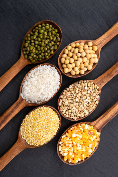 istock Wooden spoon is filled with grain 1285486176