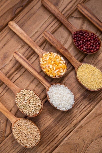 istock Wooden spoon is filled with grain 1285486231
