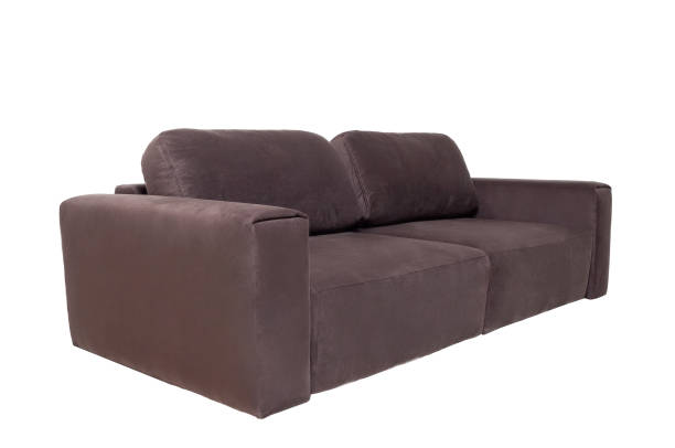 istock brown fabric sofa with pillows isolated on white background. Modern furniture 1285486415
